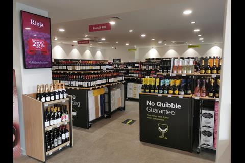 The store has a clean and modern feel, with digital screens depicting various offers.